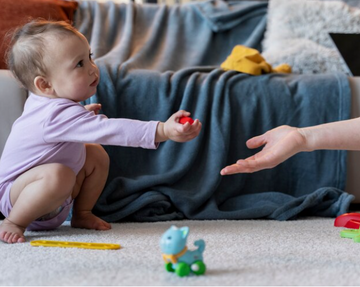 When Do Babies Start Handing You Things